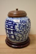 A 19th Century Chinese blue and white ginger jar with cover and stand, decorated with symbols for