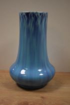An early 20th Century blue drip glazed vase, of cylindrical squat form, possibly Burmantofts of