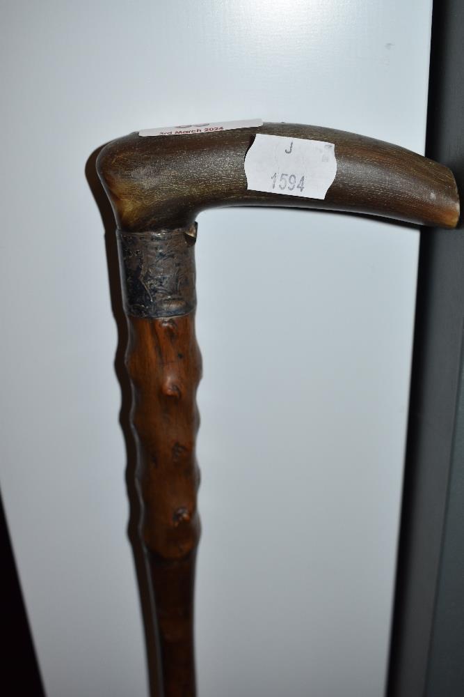 A vintage walking cane, having partial burr wood shaft, with hallmarked silver cuff (worn) and - Image 2 of 3