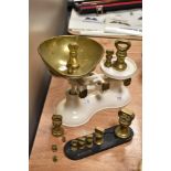 A set of Boots Nottingham weighing scale and a set of brass bell weights.