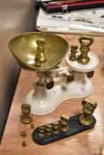 A set of Boots Nottingham weighing scale and a set of brass bell weights.