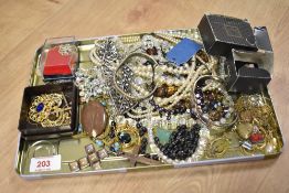 A selection of costume jewellery, including lockets,bangles, necklaces etc.