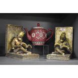 A pair of resin moulded bookends, in the form of Bellhop Reading Monkeys wearing Fez hats, each