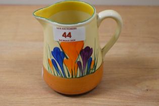 An Art Deco Clarice Cliff Bizarre cream jug, hand painted in the Crocus pattern, measuring 11cm