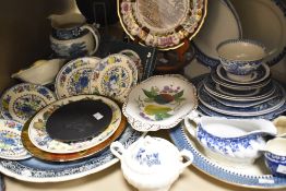 An assortment of ceramics, including blue and white plates, Masons 'Regency' saucers, salt and