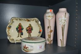 A pair of early 20th Century Royal Doulton vases, decorated with white daffodils against a pink