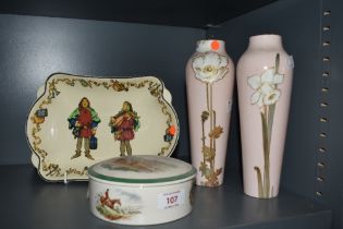 A pair of early 20th Century Royal Doulton vases, decorated with white daffodils against a pink