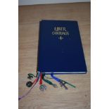 A 1978 dated Catholic song book, in Latin, having white metal bookmark charms.