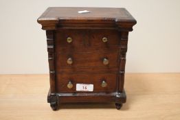 A Victorian mahogany tobacco box, with interior tin lining, modelled as a Scotch chest of drawers,