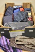 A box of gents neck ties, including a vintage cravat and silk ties.