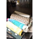 A selection of fabrics, including silk and vintage braiding and edging tapes.