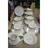 A collection of Royal Doulton 'Juno' cups, saucers, side plates, sugar and jug.