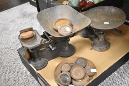 Two sets of 19th Century cast iron weighing scales with weights, the largest measures 22cm x 28cm