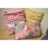 A collection of bright and cheerful good quality cushions.