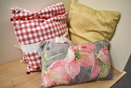 A collection of bright and cheerful good quality cushions.