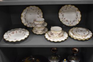 A Royal Crown Derby porcelain part tea set, in the Royal Antoinette pattern, decorated with a