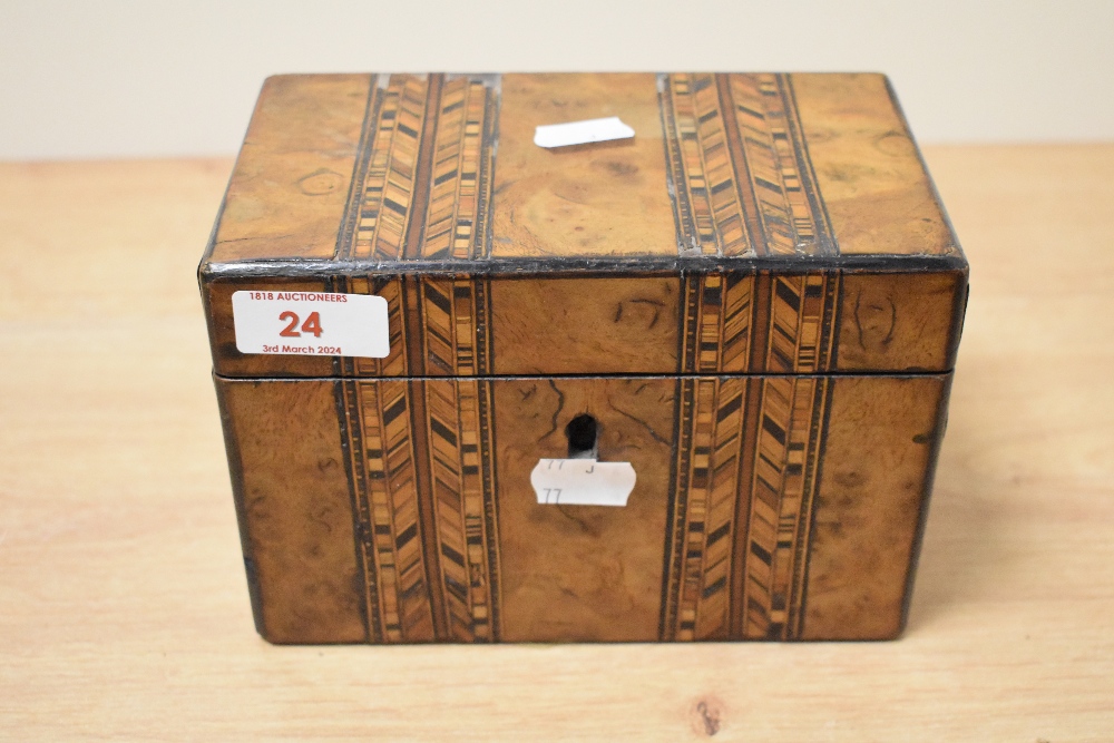 A Victorian walnut parquetry inlaid tea caddy, with double compartmented interior, key, and