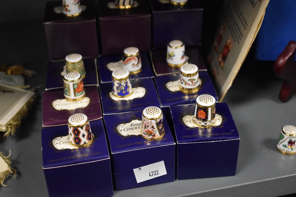 A collection of Royal Crown Derby porcelain collector's thimbles, with boxes, and informative guide - Image 2 of 3