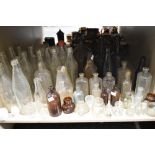 A large collection of vintage bottles, including advertising bottles of interest to Carlisle and