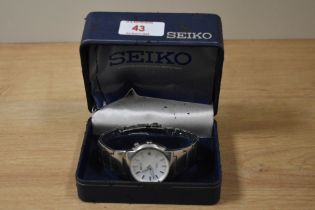 A vintage Seiko Kinetic 100m wristwatch with stainless steel strap and case