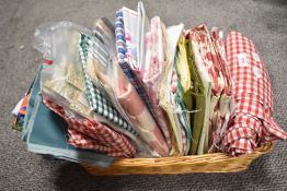 A basket full of high quality fabrics, perfect for patchwork, crafts and projects, including Laura