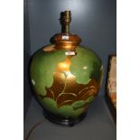 A 20th Century Chinese gold/gilt lustre lamp base, of spherical form, and raised on a hardwood