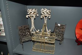 A pair of Victorian wrought iron pricket stands, measuring 35cm tall, two Indian ornamental