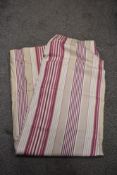 A striped cranberry and beige Laura Ashley door curtain.