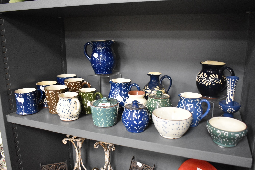 A collection of Wetheriggs Pottery, Penrith, jugs, bowls, condiment pots and mugs, having swirled - Image 2 of 3