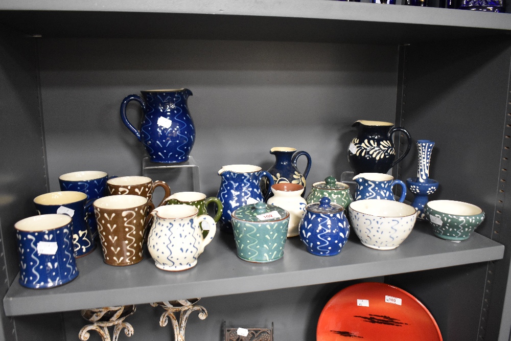 A collection of Wetheriggs Pottery, Penrith, jugs, bowls, condiment pots and mugs, having swirled - Image 3 of 3