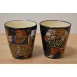 A pair of early 20th Century studio pottery treacle glazed beakers, of Continental style, with