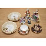 A miniature Royal Crown Derby cup and saucer and similar example, four whimsical figurines and