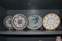 A pair of Victorian pearlware cabinet plates, hand painted with a foliate design within a blue and