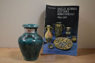 A late 19th/early 20th Century Della Robbia pottery vase, decorated with a foliate design against