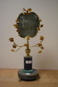 A reproduction gilt metal mounted face screen, of French style, having onyx base and column, and