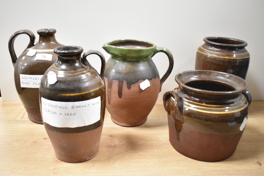 Five items of Victorian Wetheriggs pottery, Penrith, including barley wine flask and wine flask.