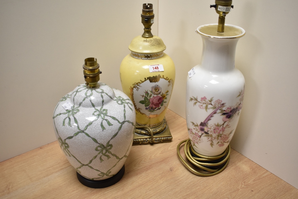 Three lamp bases, comprising yellow ceramic lamp with floral decoration, vintage crackle glazed