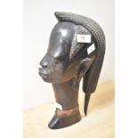 A heavy and intricately carved heavy hardwood African bust.