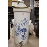 A large glazed earthenware beverage dispenser, having white ground with oriental scene in blue