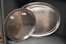 Two 20th Century Borrowdale Staybrite stainless steel trays, with hand beaten decoration and central