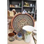 An assortment of items, to include traditional slipware platter and pot (Alsager pottery) and a Wolf