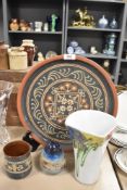 An assortment of items, to include traditional slipware platter and pot (Alsager pottery) and a Wolf