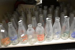 A large collection of vintage advertising milk bottles, of interest to Southport, Blackburn, Horwich