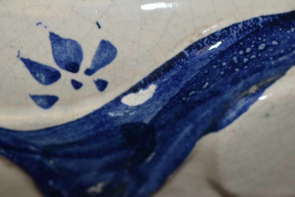 A 20th Century glazed pottery blue and white planter, in the form of a reclining figure, and stamped - Image 2 of 3