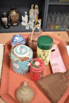 A large hexagonal painted metal tray and a collection of teapots, chopsticks and canisters.