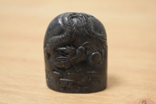An interesting Chinese soapstone carving, decorated with the dragon and pearl, measuring 5cm tall