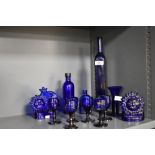 A collection of Victorian Bristol Blue glassware, to include two votive sun and moon candle holders,