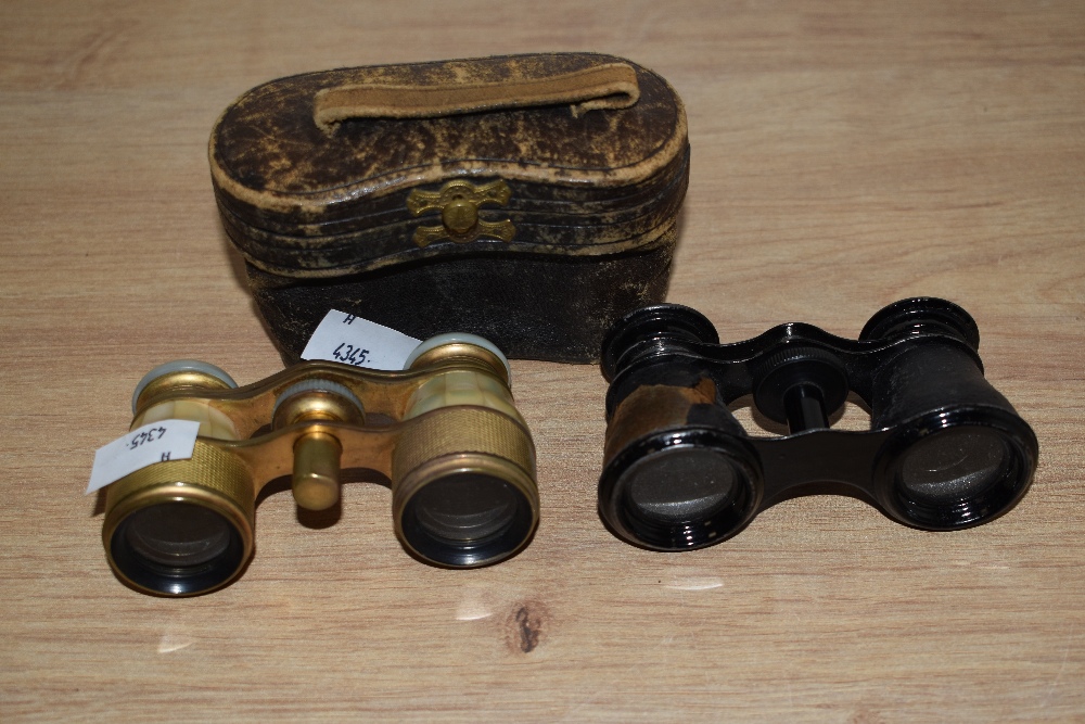 Two pairs of antique opera glasses and a case, one set leather bound, AF and a set with Mother Of