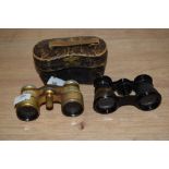 Two pairs of antique opera glasses and a case, one set leather bound, AF and a set with Mother Of