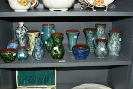 A collection of Wetheriggs Pottery, Penrith, vases of varying form, most with mottled blue and green